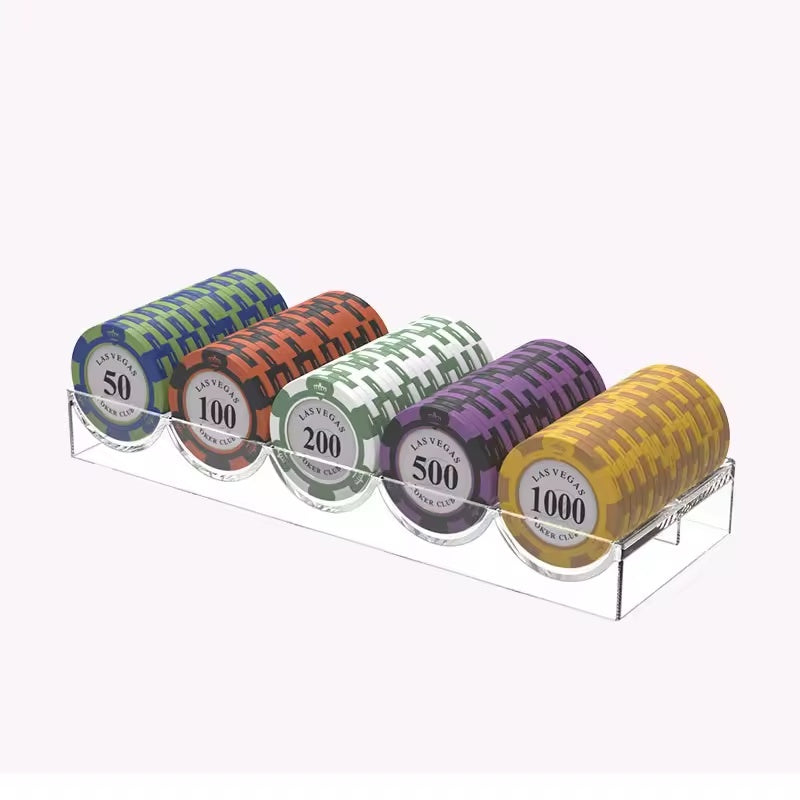 five denominations of poker chips in a clear chip tray